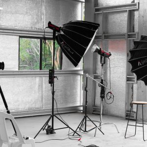 Indoor photography studio with lighting equipment and camera in Sydney.