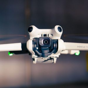 Close-up shot of a Mini 4 Pro drone hovering, showcasing advanced technology.