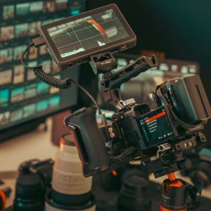 A professional video setup featuring a camera, monitor, and various gear, ready for studio filming.